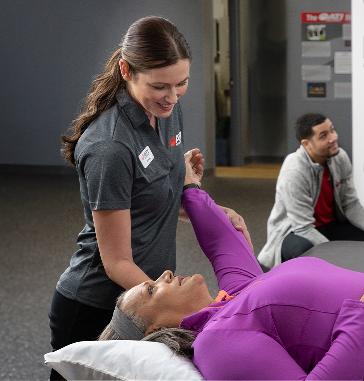 Physical therapist treating a patient